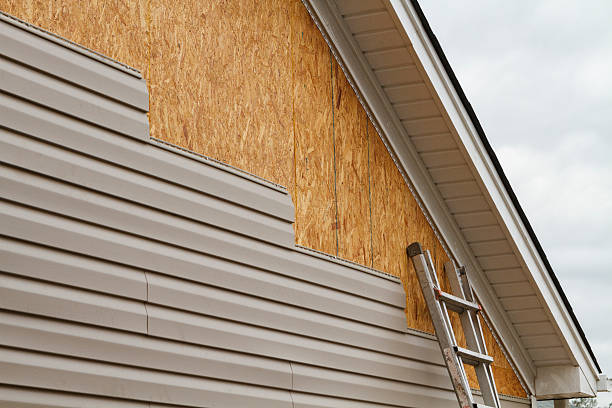 Professional Siding Contractor technician working in Hayes, VA